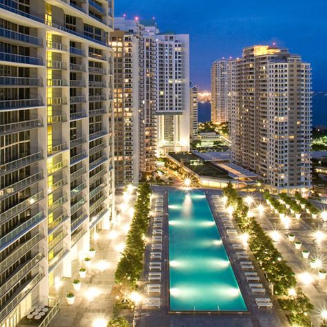 Condominium towers with pool deck at night