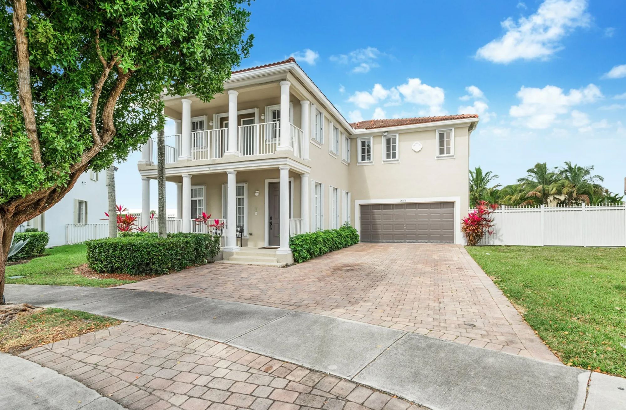 Two-story home in Homestead with paver driveway